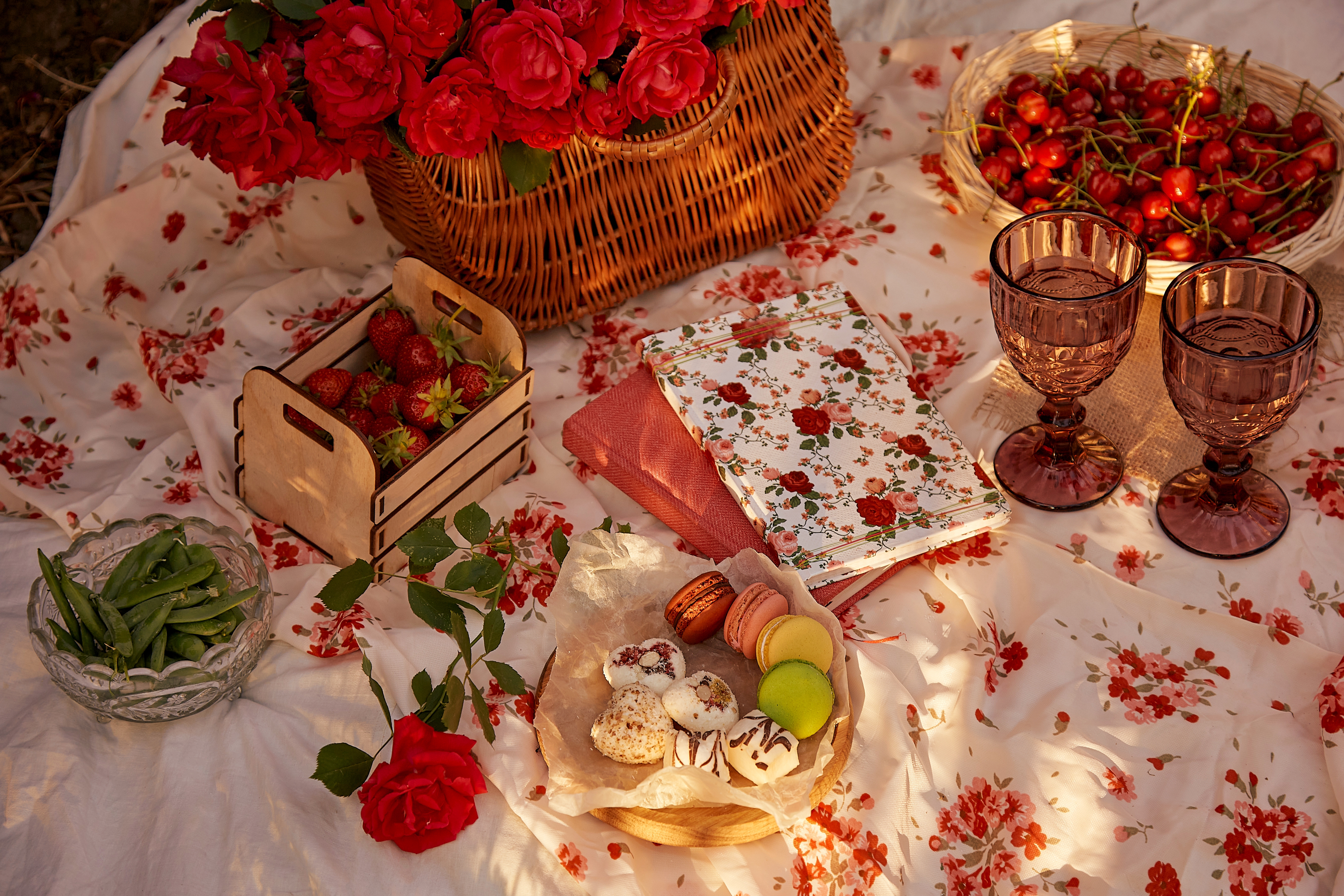 Romantic summer picnic with roses and sweets